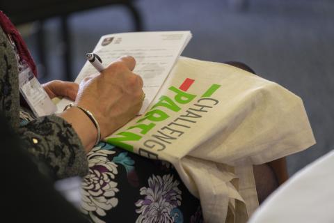 Challenge Partners tote bag at an event